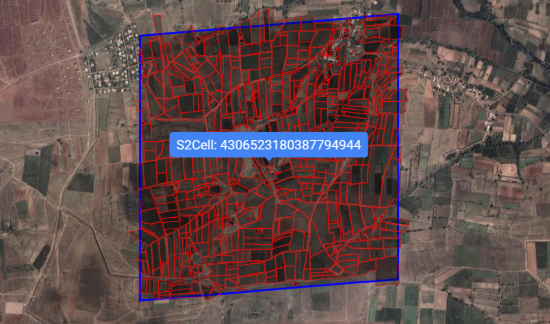 An S2 cell is marked in blue, showing multiple landscape features inside it in red color
