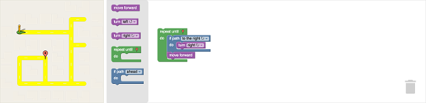 An application with a maze (the output visualization) on the left, the toolbar
in the middle, and the workspace on the right.