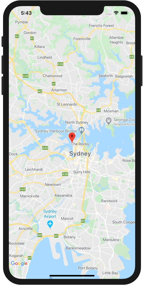 iOS app featuring a Google Map with a red marker in the center