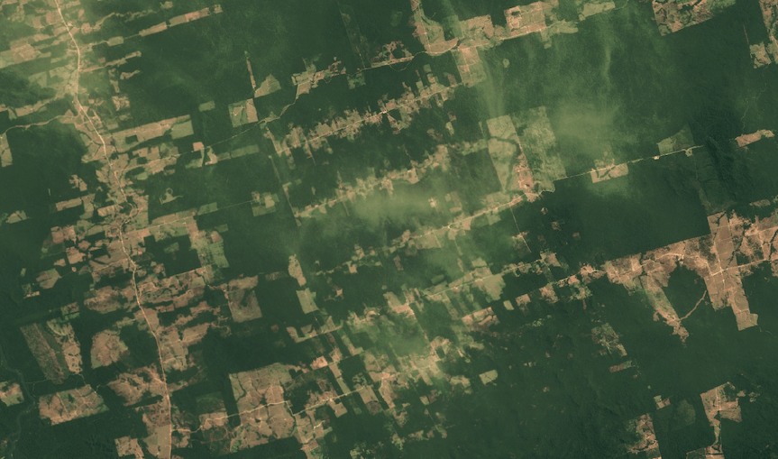 Satellite image showing residual thin hazy clouds not removed by masking.