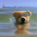 Video of a teddy bear swimming underwater.