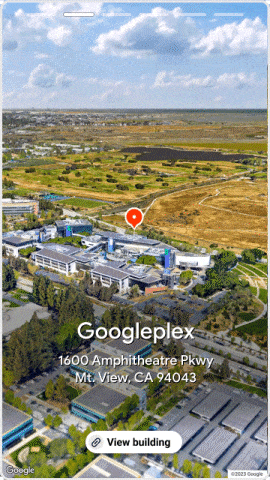 Ảnh GIF động minh hoạ ví dụ về video ở Chế độ xem từ trên không đang được hiển thị ở chế độ dọc trong một trải nghiệm giống như câu chuyện. Video Chế độ xem trên không nằm ở trang trình bày thứ hai và có một nút ở dưới cùng có nội dung "Xem toà nhà".