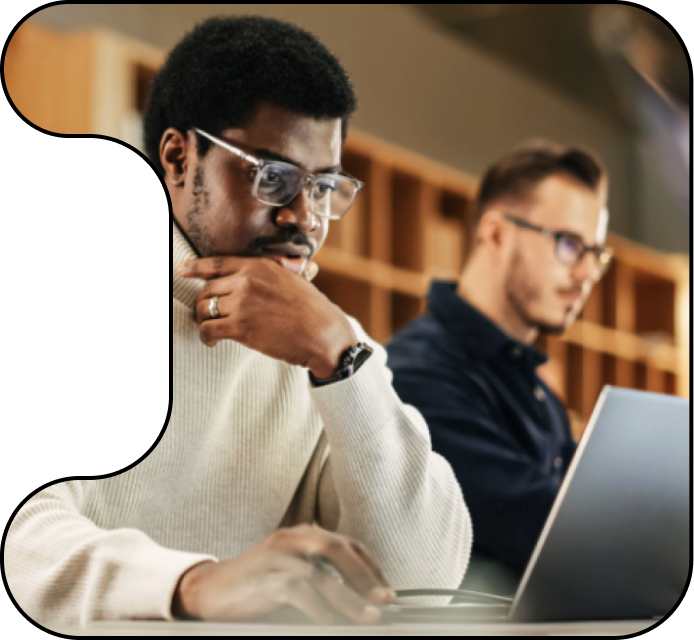 Image of two men participating in a hands-on lab.